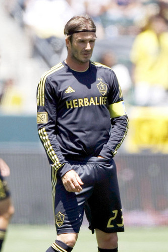 David warms up before LA Galaxy take on England's Manchester City