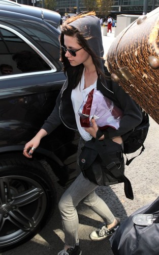 Kristen Stewart arriving at Heathrow Airport (July 31).