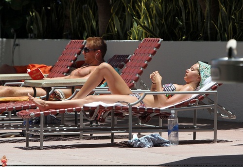 Ashley -Relaxing poolside at her hotel in Miami - July 31, 2011