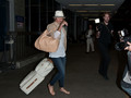 Cameron Diaz pulls a set of gravity-defying moves at LAX after a long and apparently fun flight.  - cameron-diaz photo