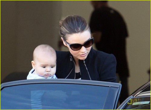  Miranda Kerr carries her 6-month-old son Flynn while leaving a litrato shoot on Tuesday (August 2)