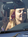 Miley Cyrus performs an illegal U-turn in West Hollywood. [August 9, 2011] - miley-cyrus photo