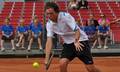 Adam Pavlasek with long hair - tennis photo