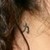  A symbol for strength on the back of her neck.