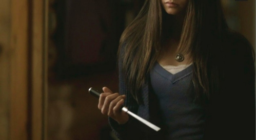  Where are Elijah and Elena when he says, "I'm going to have to call your bluff." after Elena threatens to stab herself with a very large knife?