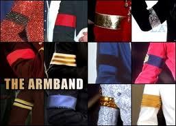  What does the arm band that Michael wears on his right upper arm represent?