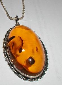  This pendant was made of Bronzite.