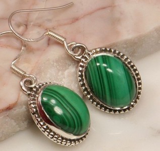  These earrings were made of Malachite.