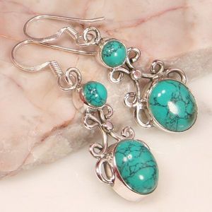  These earrings were made of Turquoise.