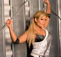 Who did Natalya attack in her debut on Smackdown in WWE?