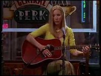 Who was eating a piece of cake at the coffee house when Phoebe was singing the song "Little Black Curly Hair"?