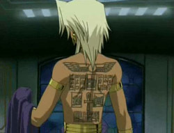 Marik without his shirt showing off his back
