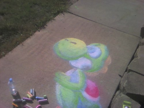 Yoshi drawn on the sidewalk