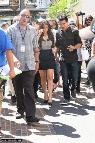  Kim photographed at The Grove shooting for 'Extra' with Mario Lopez 9/24/10