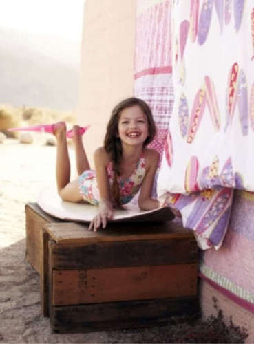  Renesmee playing on a surf board