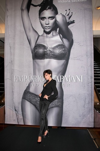  Victoria standing in front of her Emporio Armani Underwear Poster!