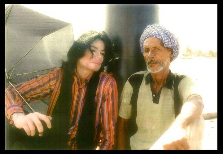 michael sitting with an arabic man in oman