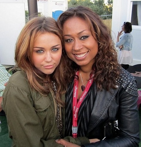  Miley with her backing singer Carmel.
