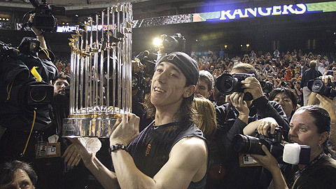  Tim holding the world series trophy