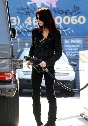 23.11 - Ashley at the gas pump