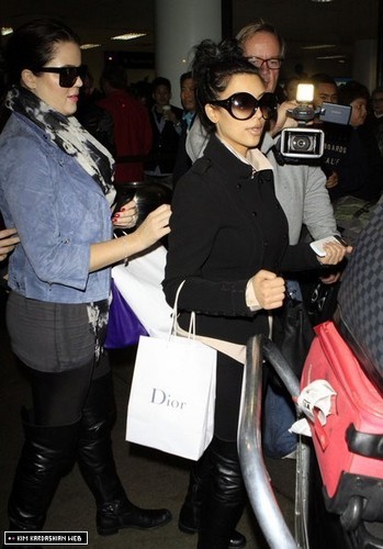  Kim and Khloe arrive back in LA after their South Africa trip 12/19/10