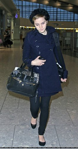  Emma Watson at Heathrow Airport On Friday (December 31st)