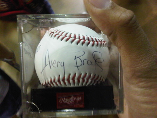 A baseball autographed by Avery Brooks