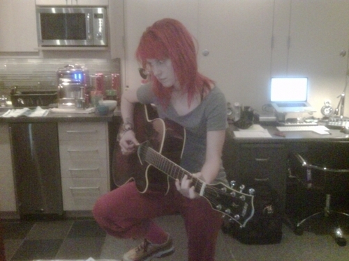  Hayley working on the acoustic гитара