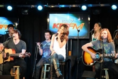 Selly singing her latest hit single "Who Says" on KIIS FM