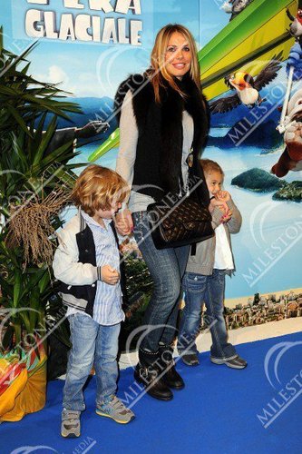 Ilary Blasi and her sons Christian (L) and Chanel (R) attend 'Rio' premiere at Cinema