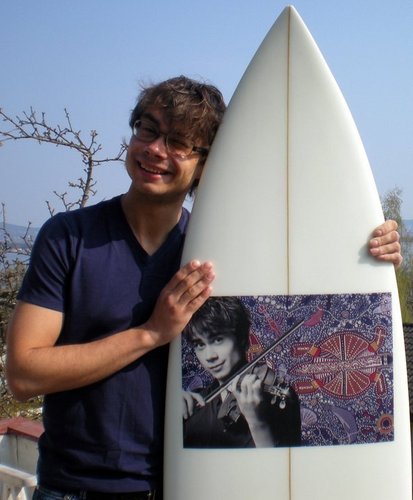  Alex and his awesome present from a fan, a surfboard!