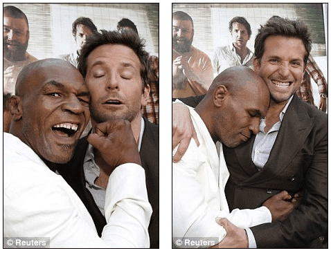 Mike Tyson swings playfully at cast member Bradley Cooper during premiere of The Hangover Part II