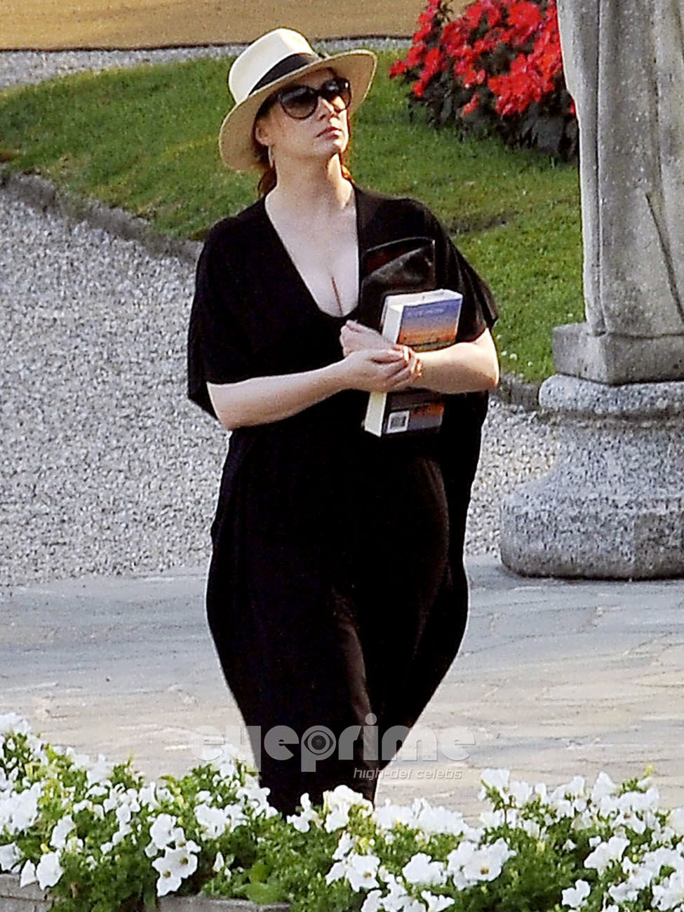 Christina Hendricks relaxing by the Hotel Pool in Lake Como, Italy.