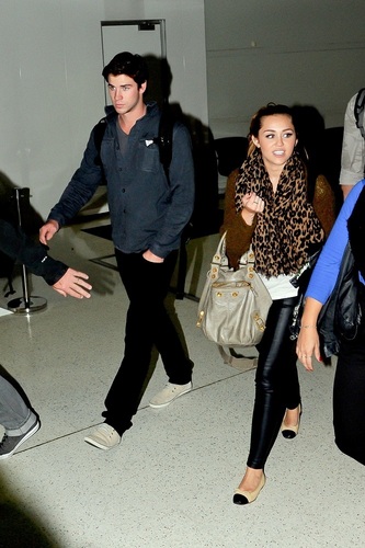  Miley - At Sydney Airport with Liam in Australia - June 20, 2011