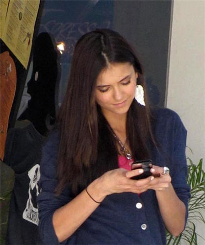  Nina on her phone.