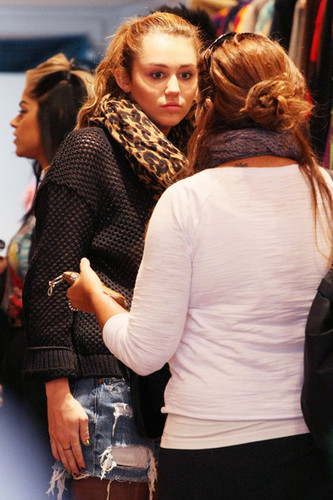 Miley Cyrus goes shopping with her mom Tish on Oxford Street