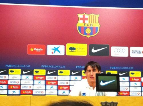 Bojan winking at Puyol before the start of the Press Conference