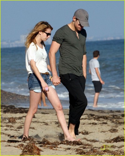 Chord Overstreet an Emma Roberts hold hands as they take a stroll along the beach on Sunday July 24