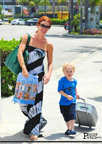  poppy Montgomery arrives LAX airport with her son, Jackson (7/9/11)
