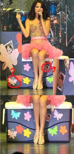  Selena is sitting on a box with stickers of Justin!