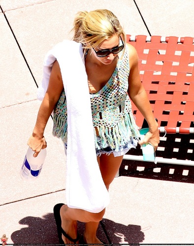  Ashley -Relaxing poolside at her hotel in Miami - July 31, 2011