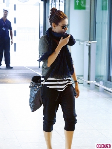  Mila Kunis arrive at London's Heathrow Airport in London, UK.