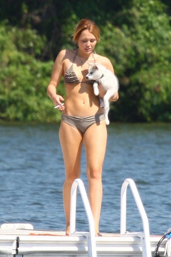  Miley - Enjoys a relaxing día with friends in Orchard Lake, MI - July 31, 2011