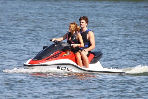  Miley - Enjoys a relaxing hari with friends in Orchard Lake, MI - July 31, 2011