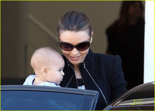 Miranda Kerr carries her 6-month-old son Flynn while leaving a photo shoot on Tuesday (August 2)