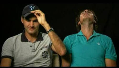  Nadal threw back his head and he about to किस Roger