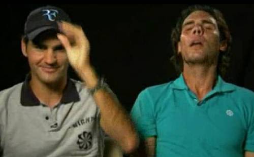  Nadal threw back his head and he about to किस Roger