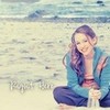 Myley sitting on the beach swarla photo